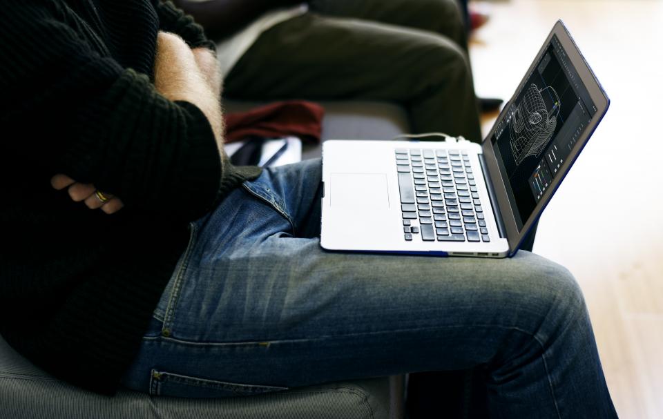 someone looking at a laptop